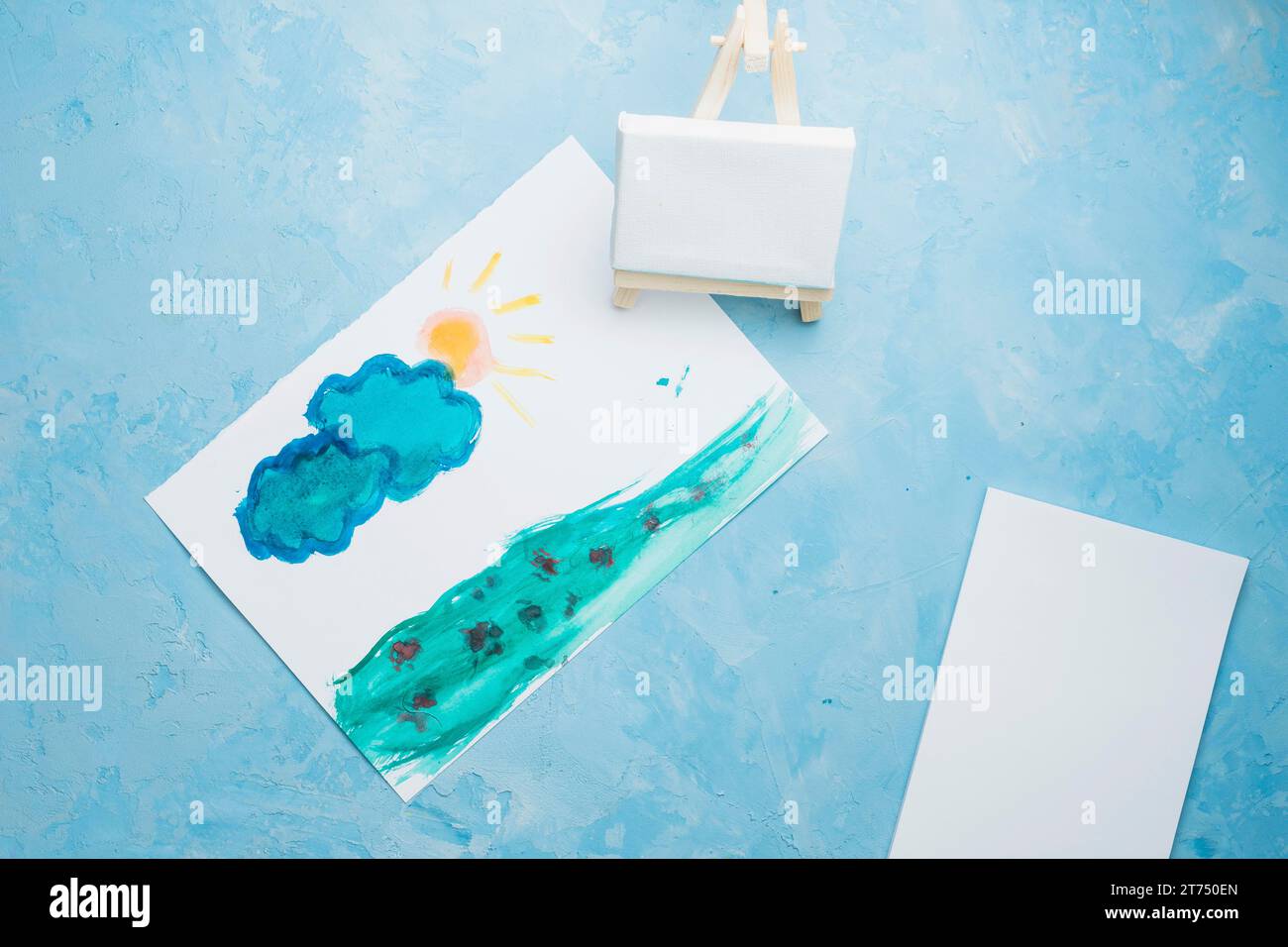 Hand drawn paper painting with mini easel watercolor backdrop Stock