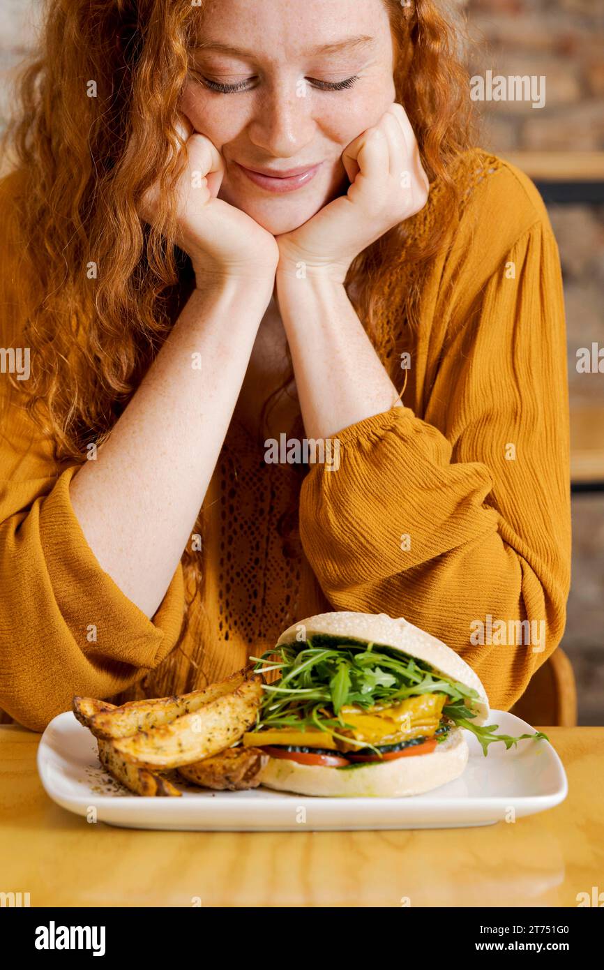 Close up smiley woman with food Stock Photo