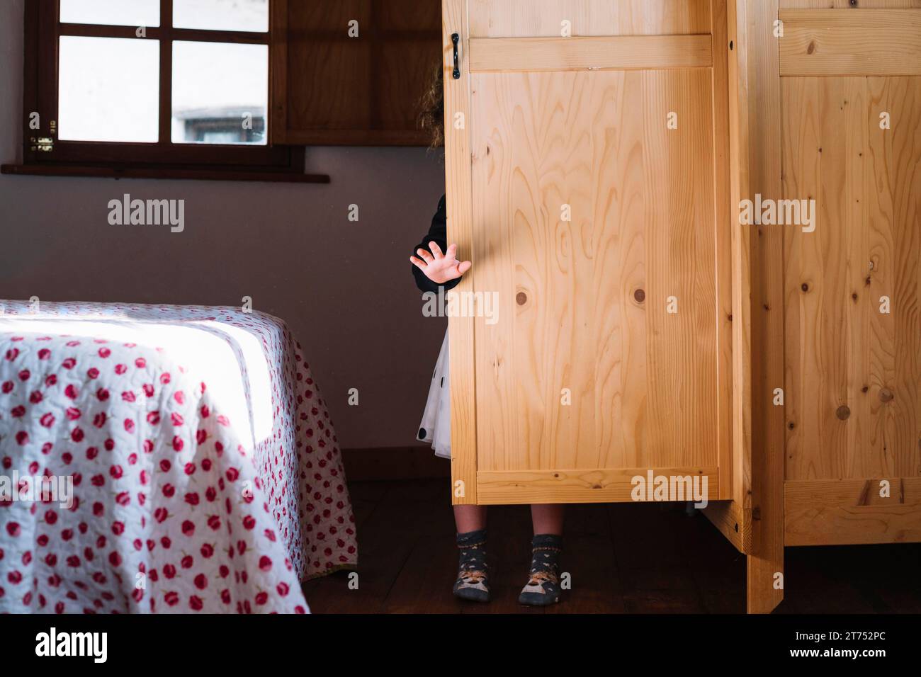 Girl standing wooden cupboard Stock Photo Alamy