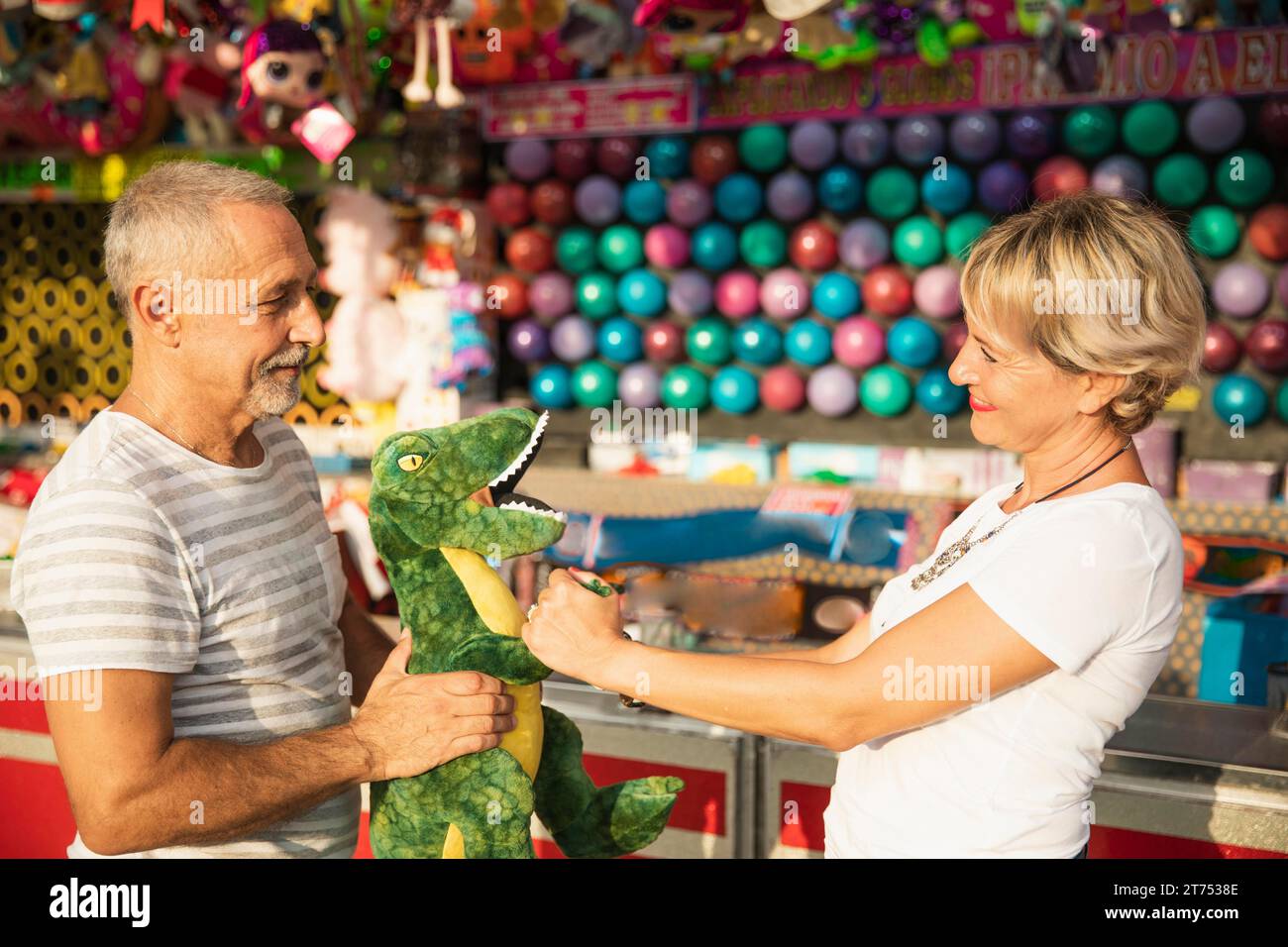 Medium shot people with dinosaur toy Stock Photo