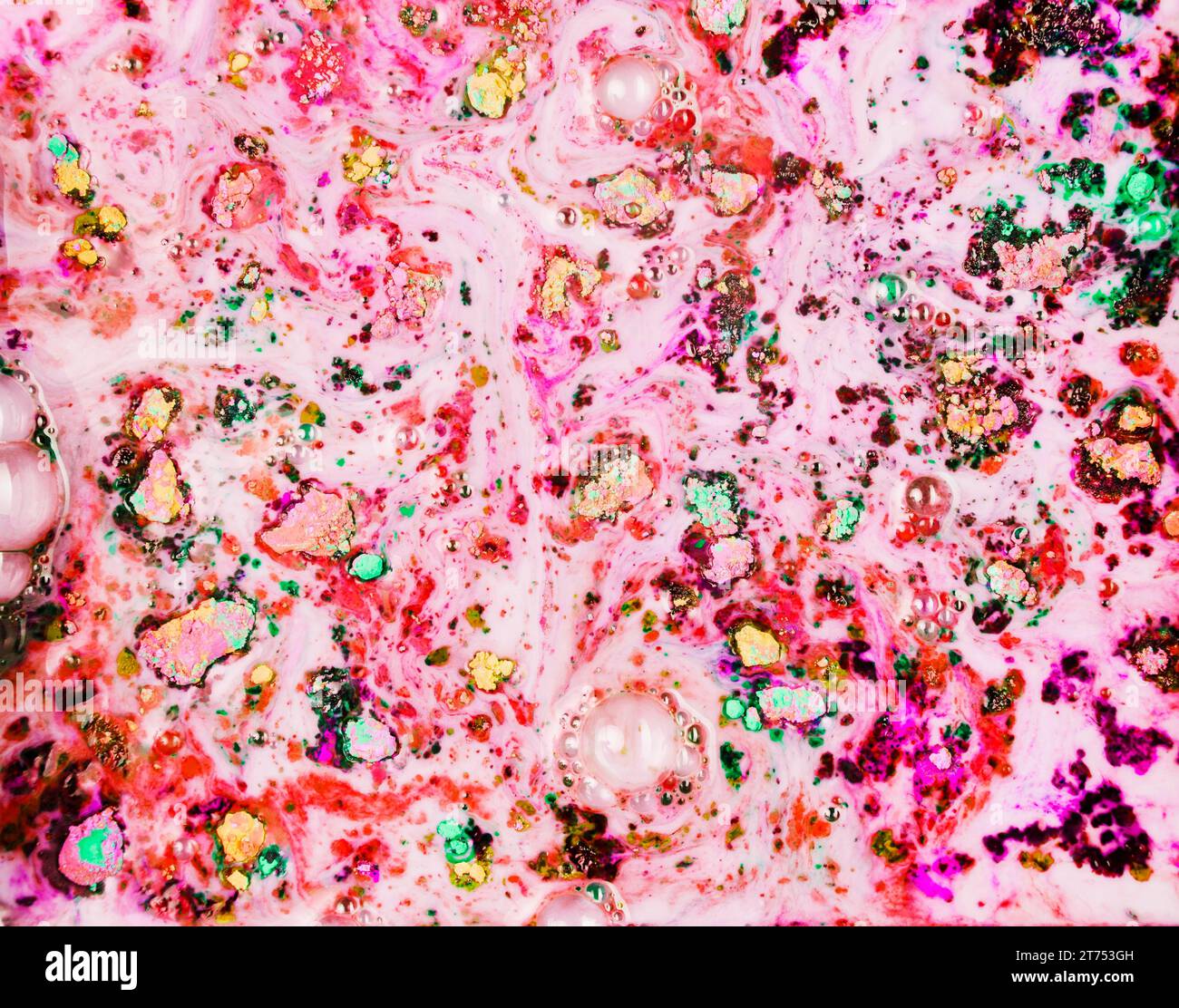 Painted pink powder dark water Stock Photo - Alamy