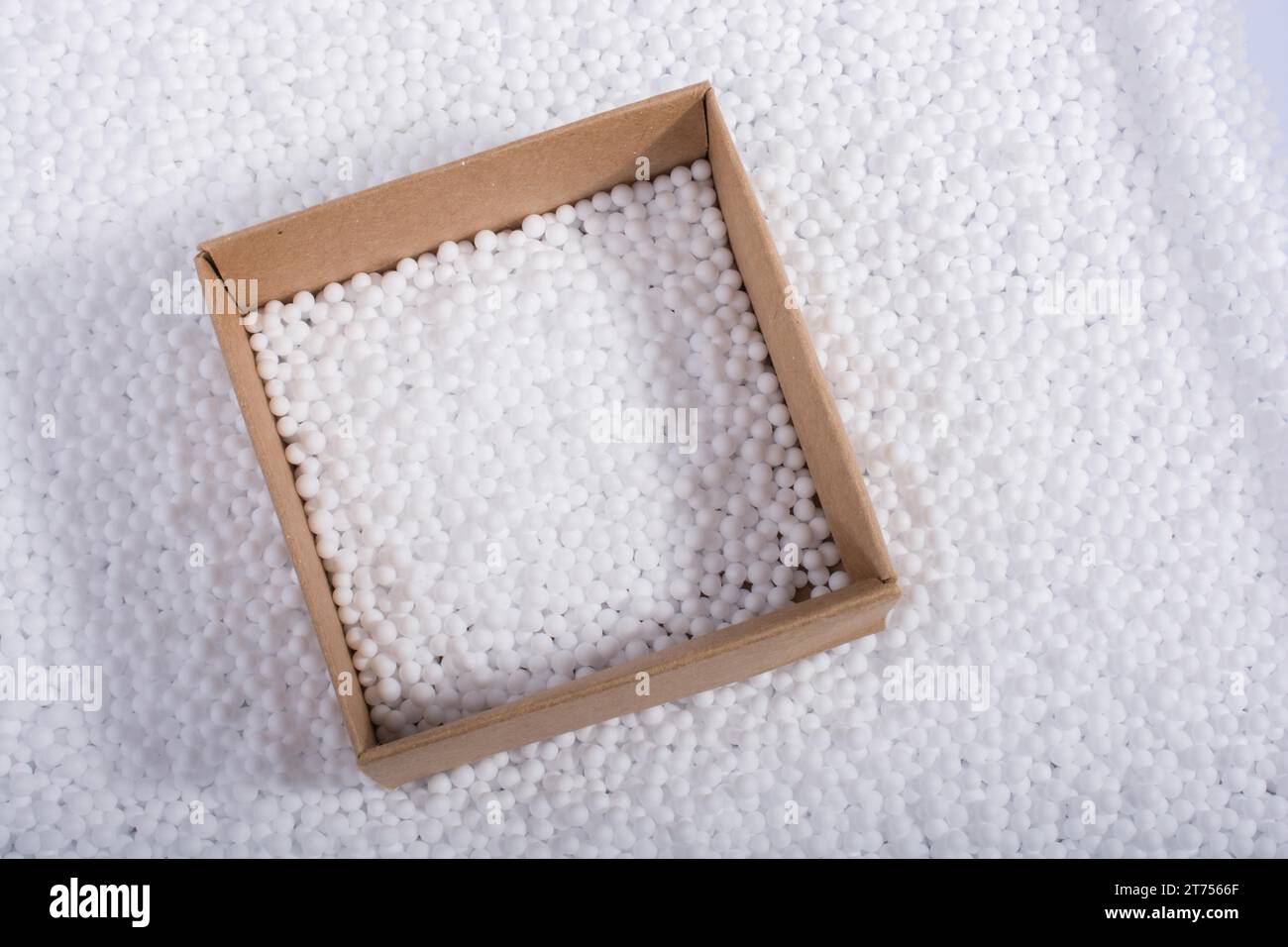 Box on little white polystyrene foam balls Stock Photo