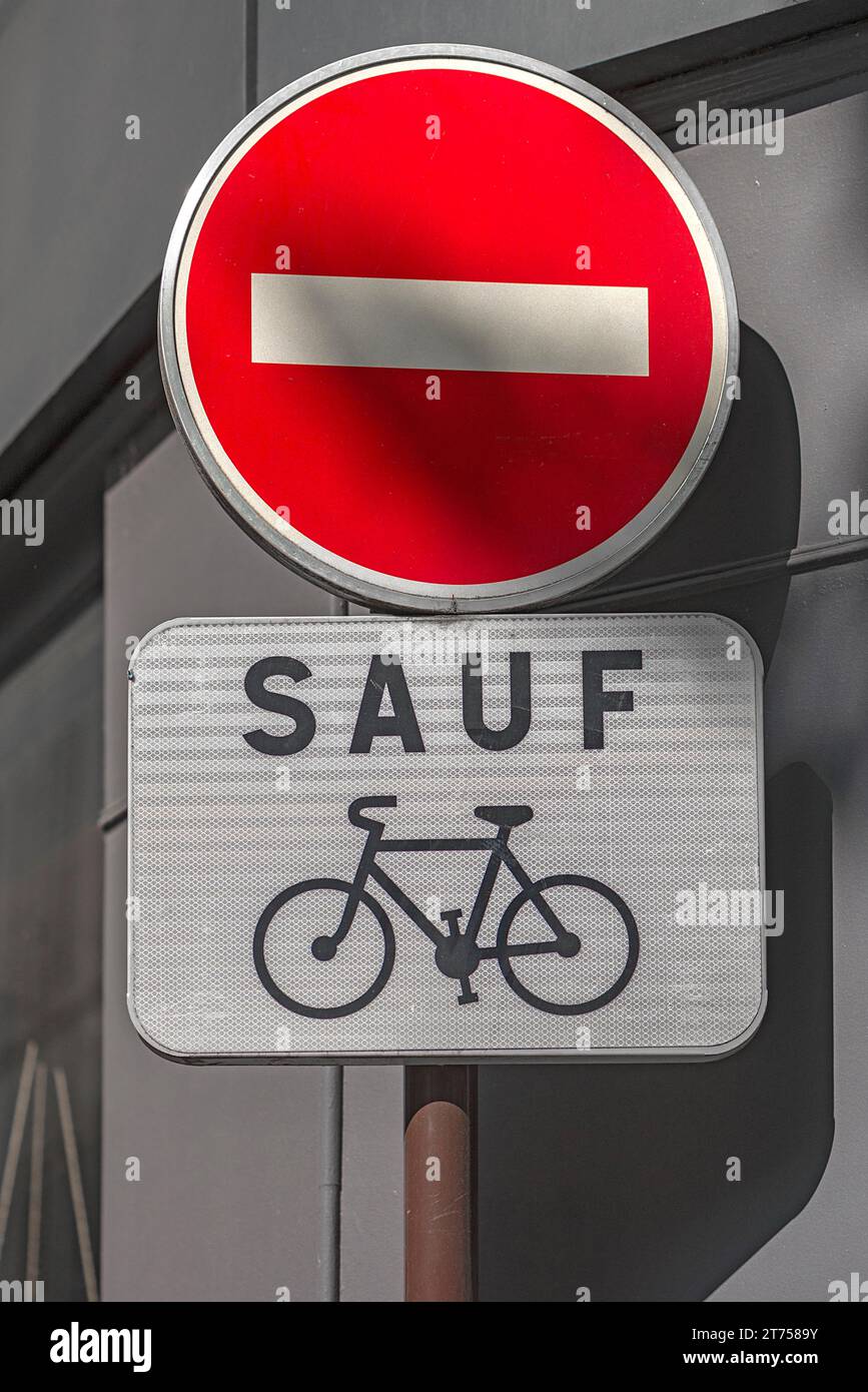 One-way street sign, but bicycles allowed, Paris France Stock Photo