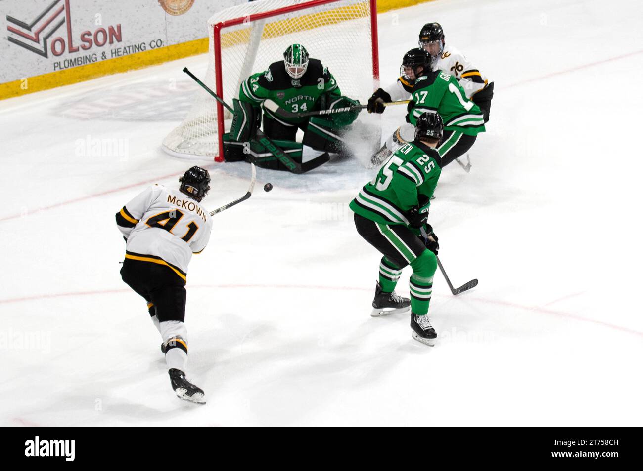 Hunter McKown of Colorado College(#41) fires a shot toward the goal during a collegiate hockey game at Robson Arena, Colorado College Campus/ Stock Photo