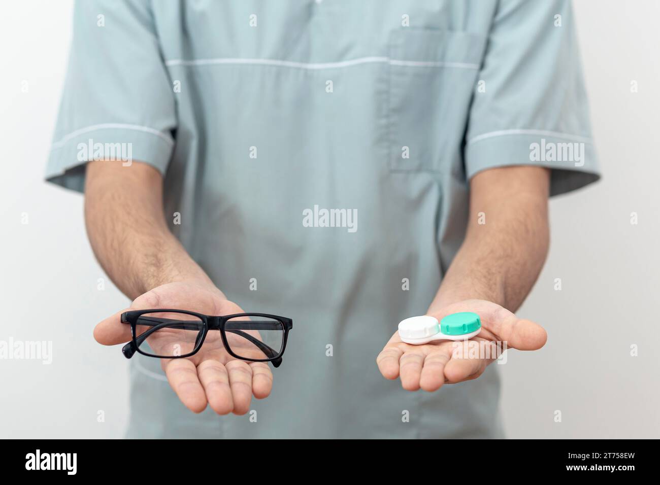 Front view eye specialist holding glasses contact lenses Stock Photo
