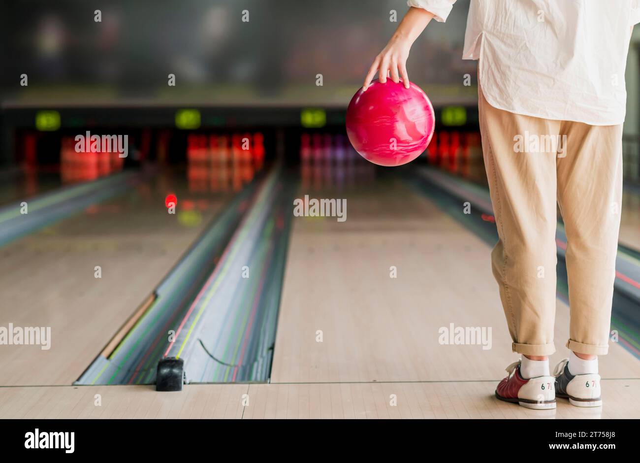 Person holding bowling ball Stock Photo