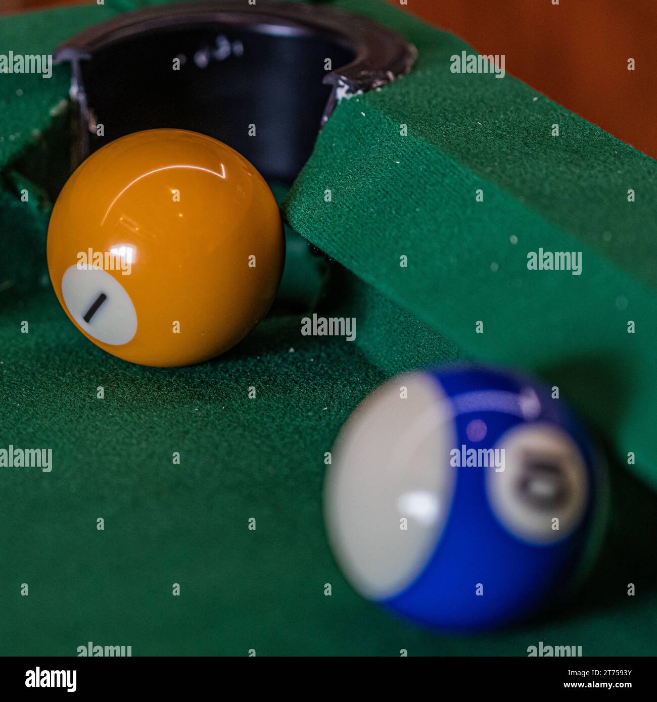 Billiard table setup featuring colorful pool balls, ready for an