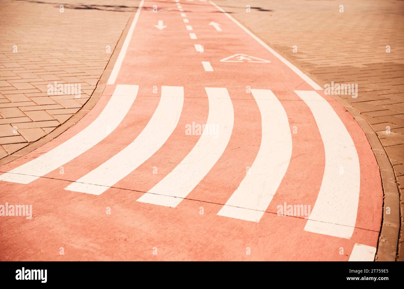 Cross walk directional arrow sign cycle lane with pavement Stock Photo