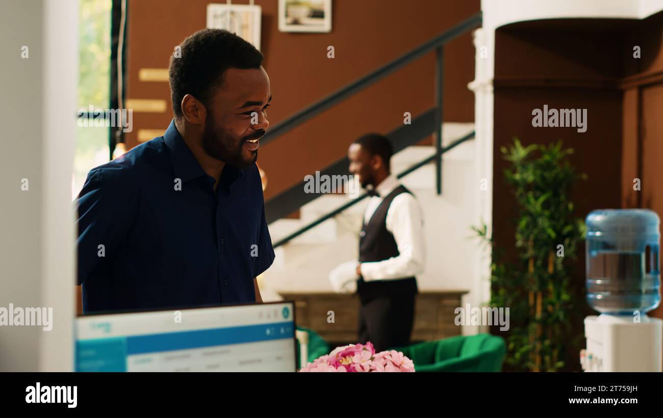 Man arriving reception desk hi-res stock photography and images - Alamy