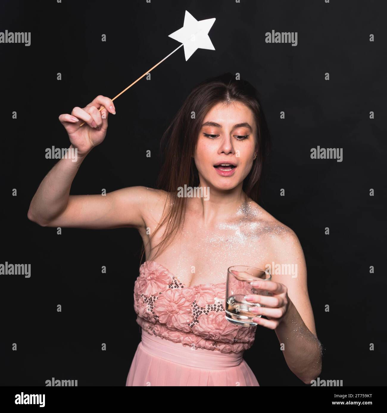 Fairy woman waving magic wand glass Stock Photo