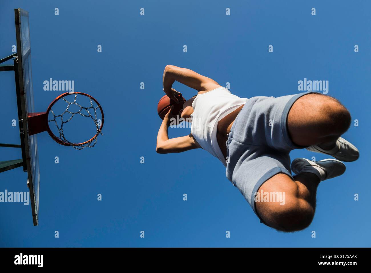 Jump shot basketball player Stock Photo - Alamy