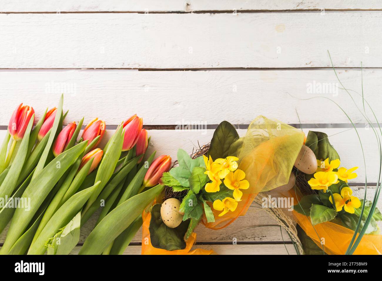 Tulips near easter wreath Stock Photo