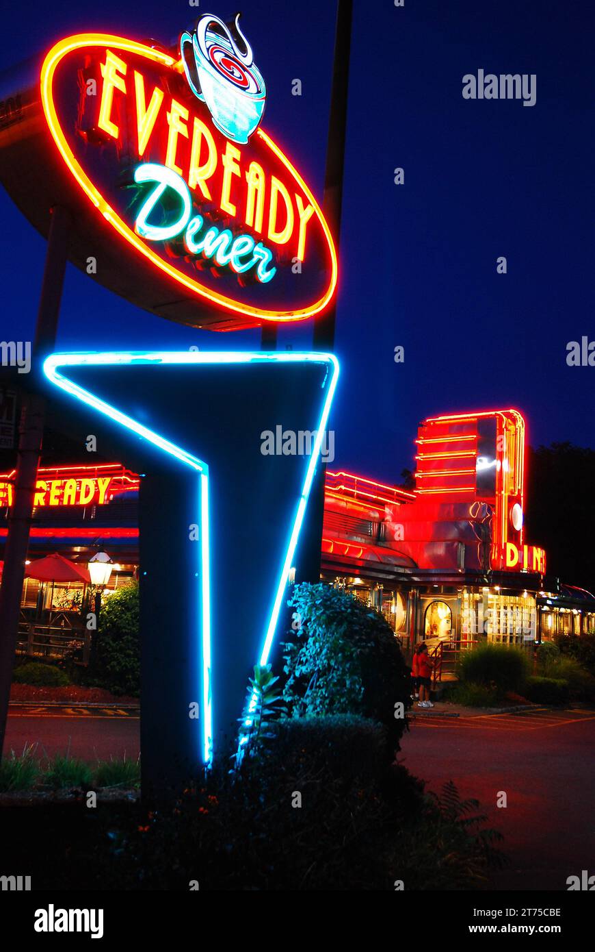 The neon sign of the Eveready Diner, in Hyde Park, New York, is illuminated against the dusk sky Stock Photo