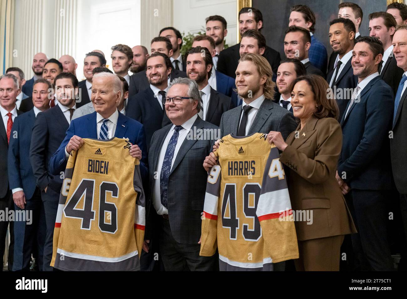 Washington, United States. 13th Nov, 2023. U.S President Joe Biden, left, and Vice President Kamala Harris, right, pose holding ice hockey jerseys presented during an event celebrating the Vegas Golden Knights 2023 Stanley Cup victory in the State Dining Room of the White House, November 13, 2023 in Washington, DC Credit: Adam Schultz/White House Photo/Alamy Live News Stock Photo