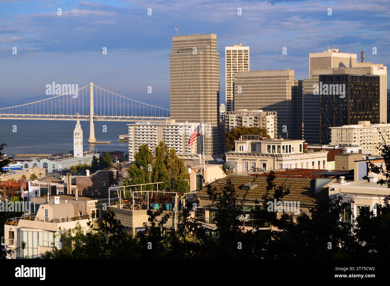 The skyline of the downtown San Francisco business district rises net the Bay Bridge Stock Photo