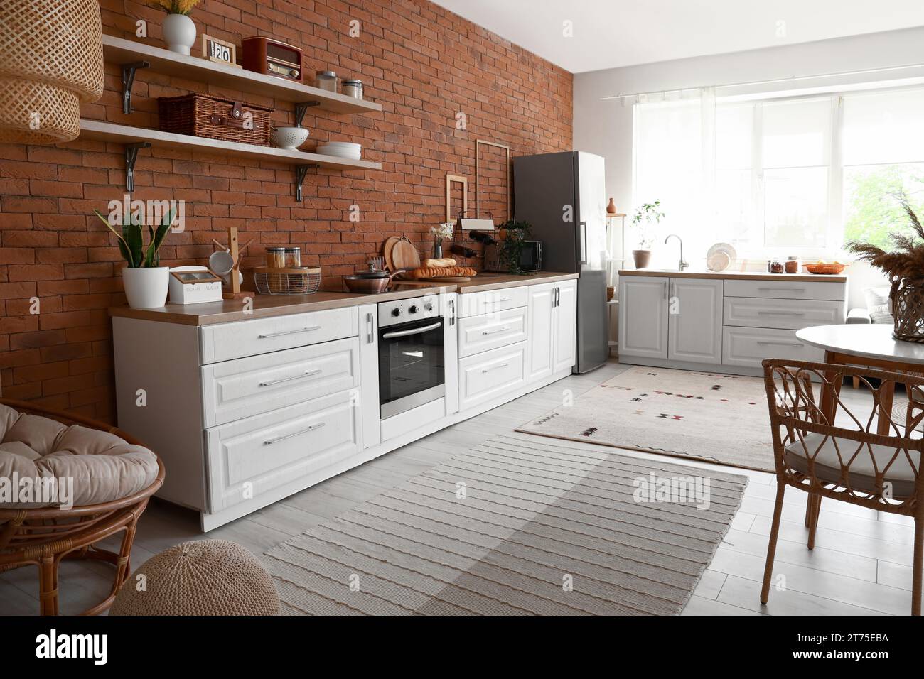 Interior of kitchen with stylish fridge, counters and shelves Stock ...