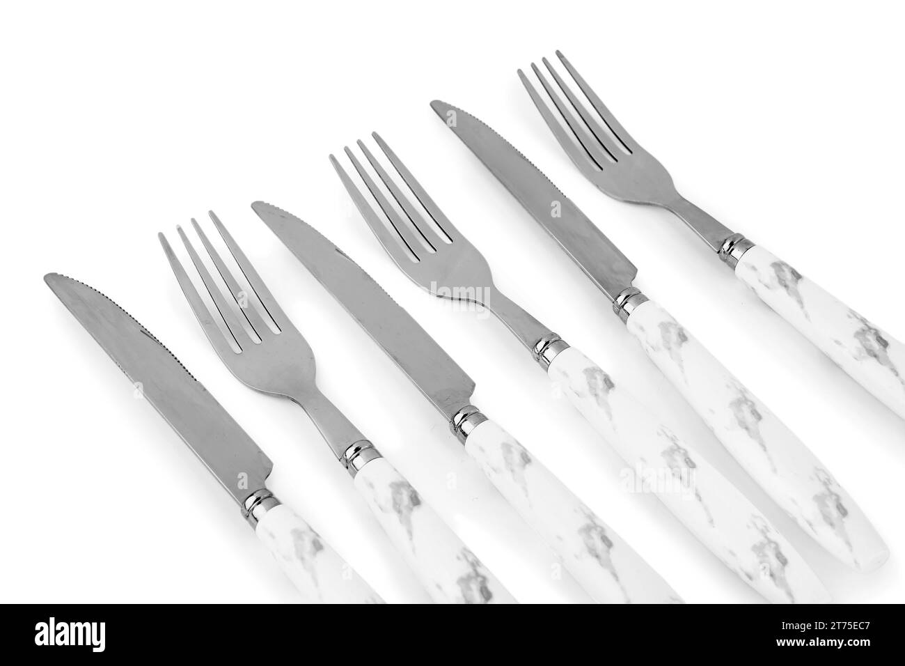 Stainless steel forks and knives with plastic handles on white background Stock Photo