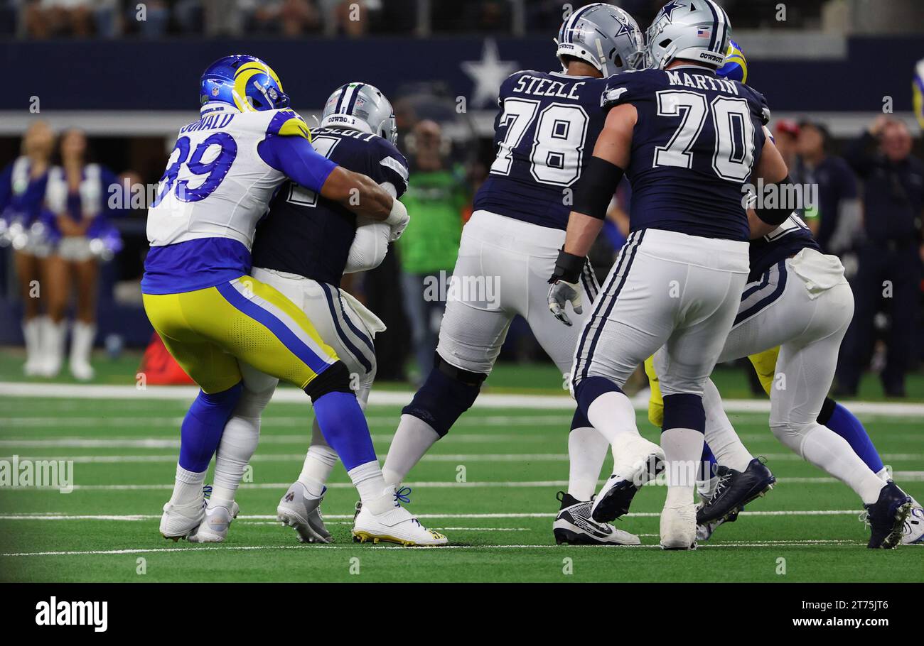 Arlington,TX USA: Los Angeles Rams defensive tackle Aaron Donald (99) bear hugs and eventually sacks Dallas Cowboys quarterback Dak Prescott (4) durin Stock Photo