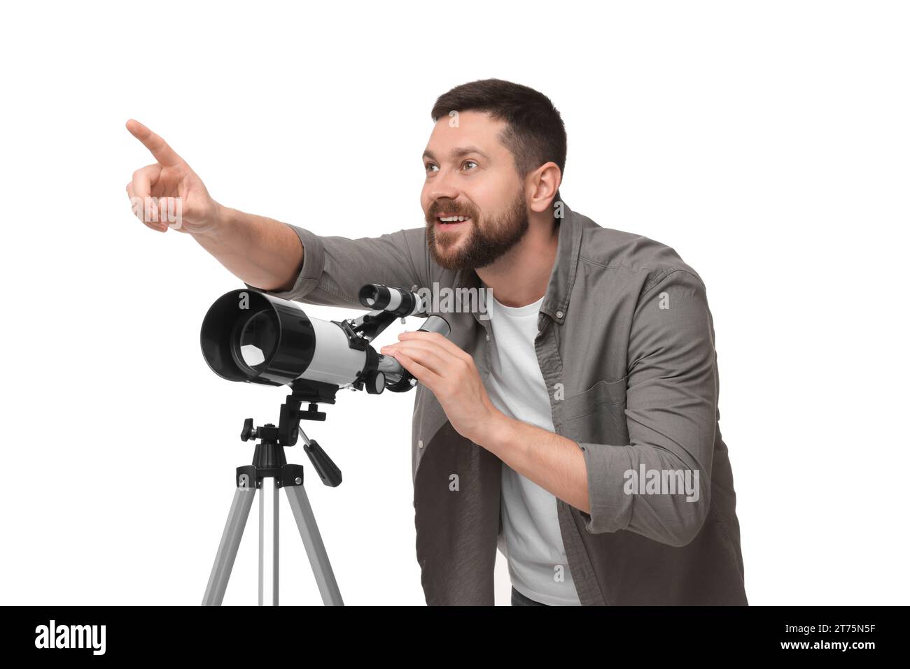 Happy astronomer with telescope pointing at something on white