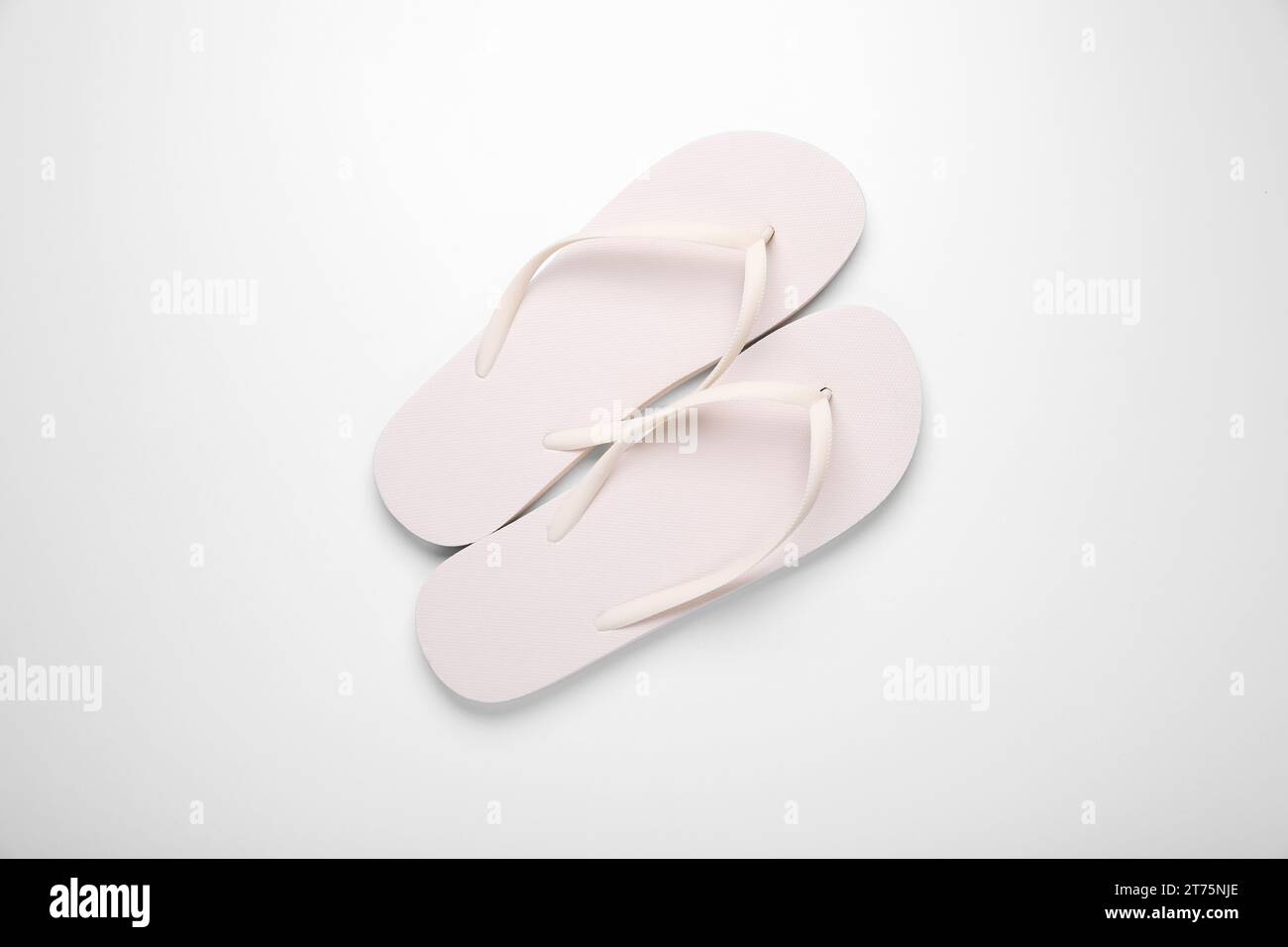 Stylish flip flops on white background, top view Stock Photo - Alamy