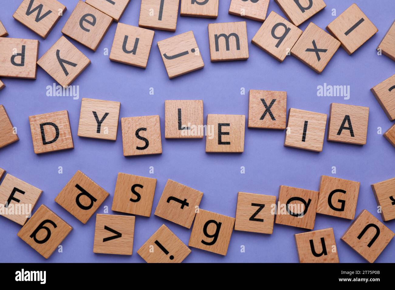 Wooden cubes with word Dyslexia on violet background, flat lay Stock ...