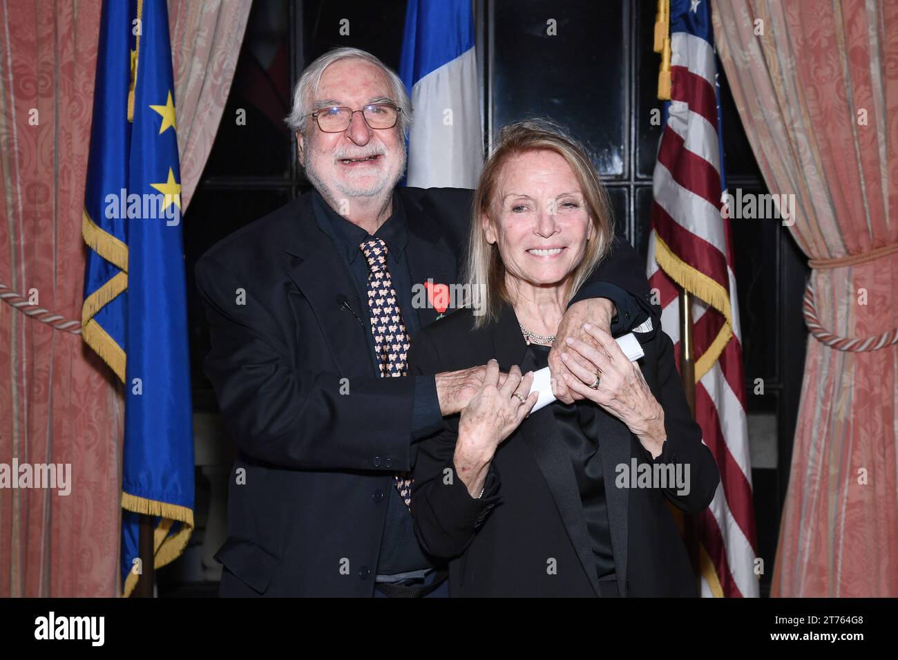 New York, USA. 13th Nov, 2023. French-American photojournalist Jean-Pierre Laffont (l) holds his wife Eliane Laffont (r) after receiving the insignia of Knight in the National Order of the French Legion of Honor, at the Consulat General de France in New York, NY, November 13, 2023. (Photo by Anthony Behar/Sipa USA) Credit: Sipa USA/Alamy Live News Stock Photo