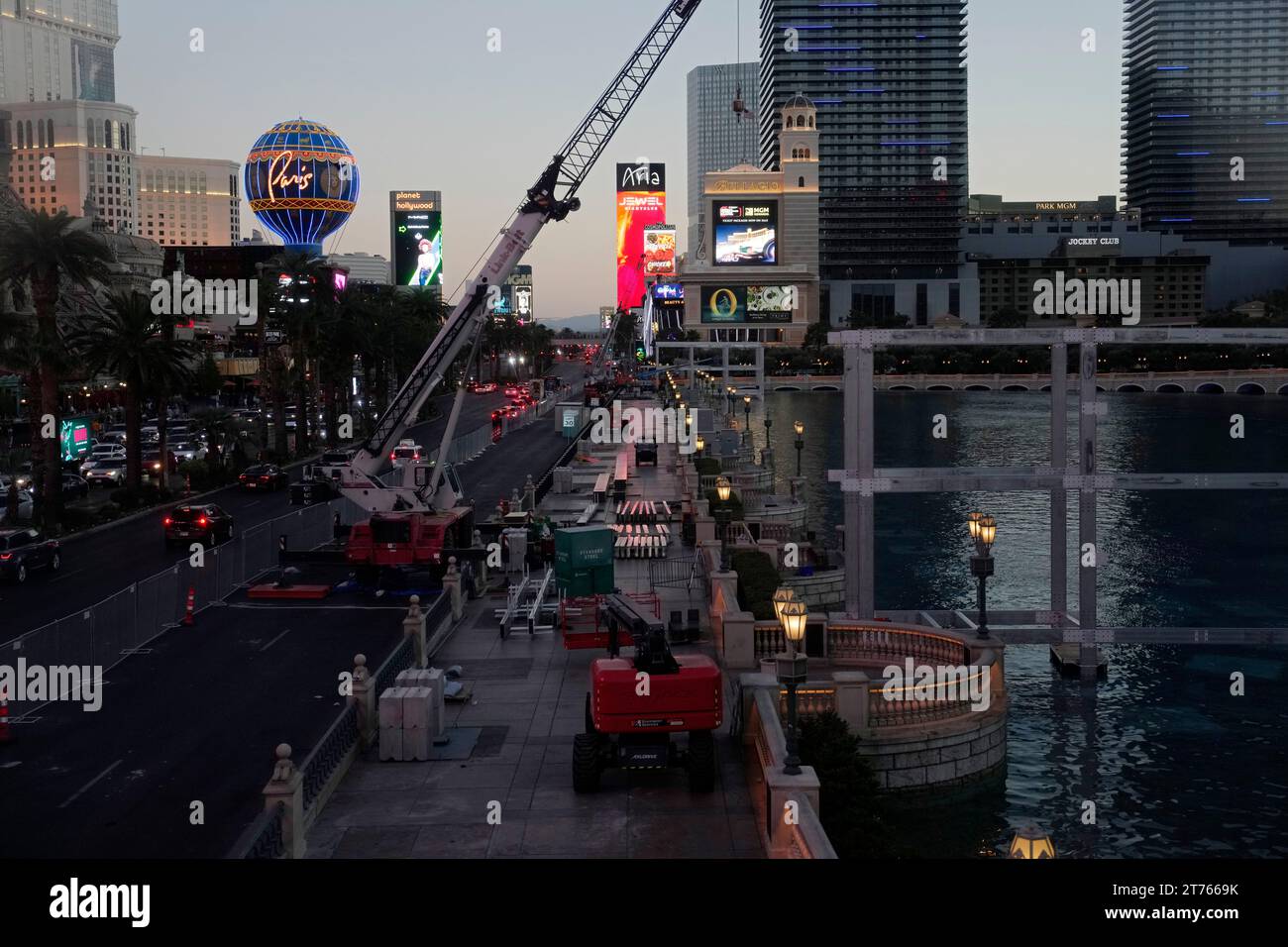 Construction workers build a grandstand in front of the fountains at