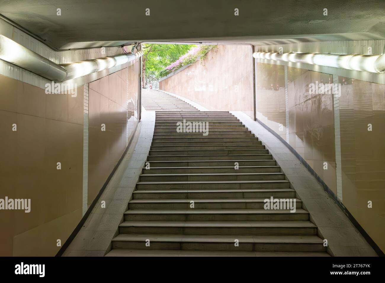 looking out inside an underground pedestrian tunnel Stock Photo