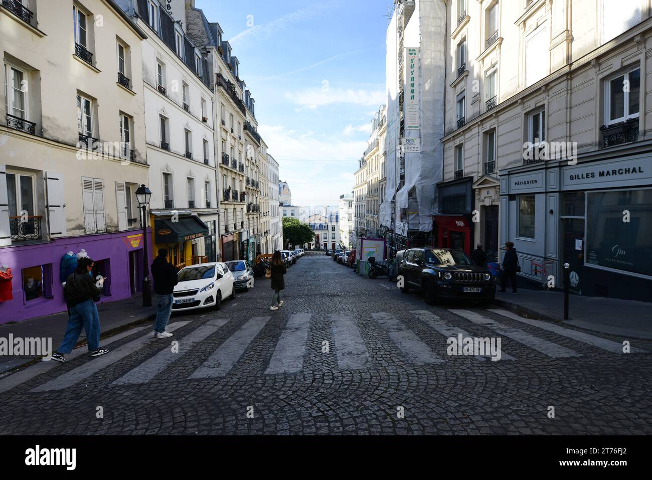 Walking down on Rue Ravignan in Montmartre, Paris, France. Stock Photo
