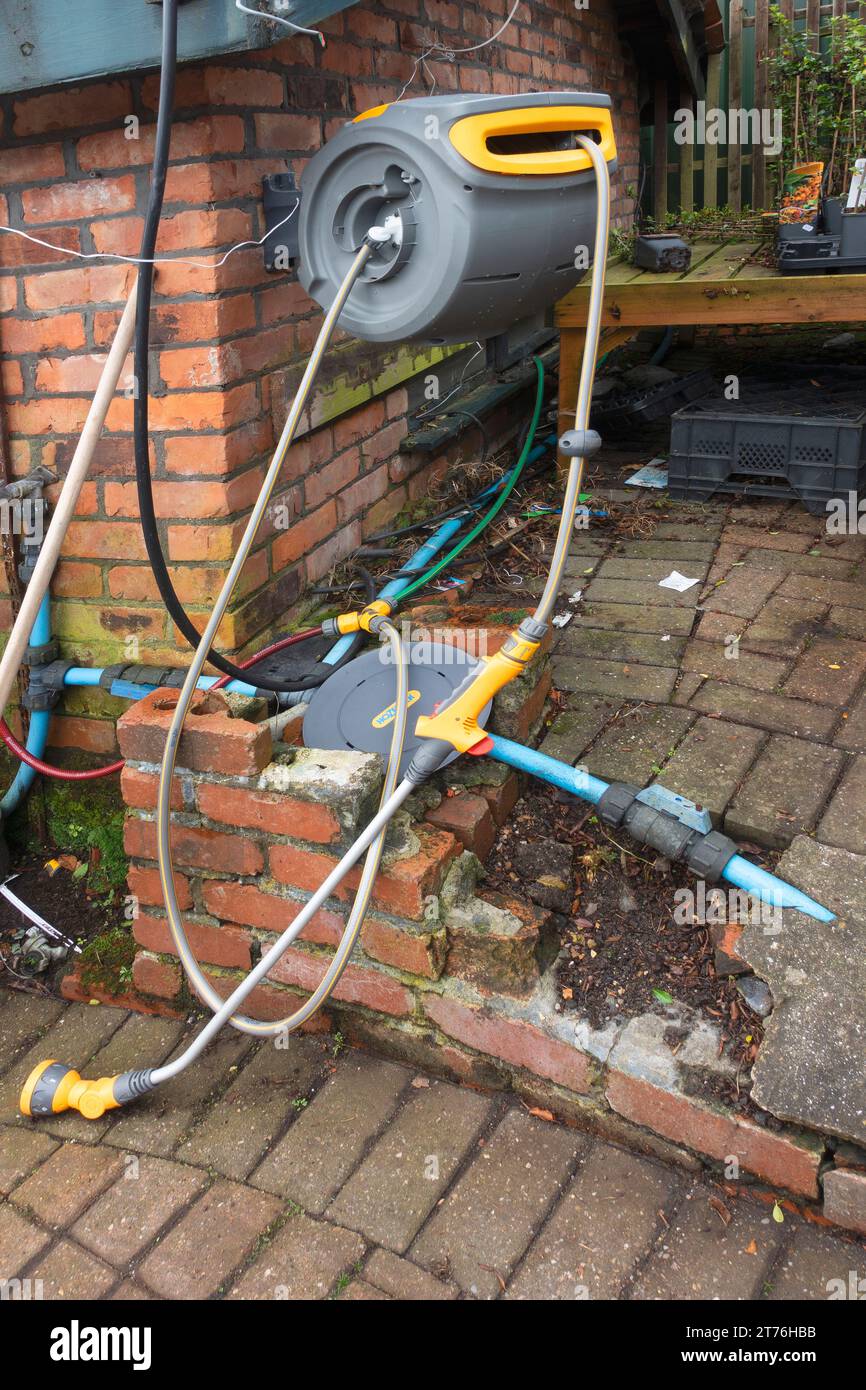 a-market-garden-hose-reel-with-grey-kink-resisting-hose-on-a-wall