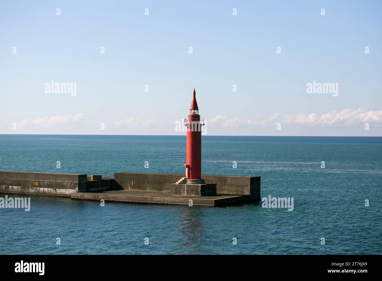 Red lighthouse in the port of Niigata on the northern coast of Japan. Stock Photo
