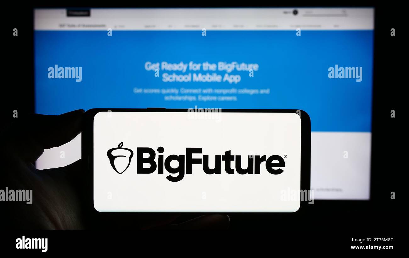 Person holding cellphone with logo of US educational online planning guide BigFuture in front of webpage. Focus on phone display. Stock Photo