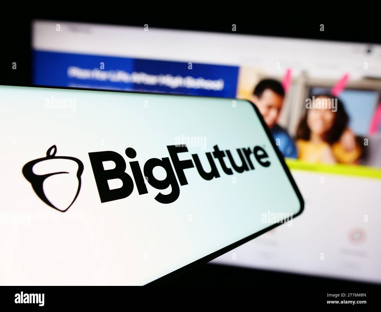 Mobile phone with logo of American educational online planning guide BigFuture in front of website. Focus on center-left of phone display. Stock Photo