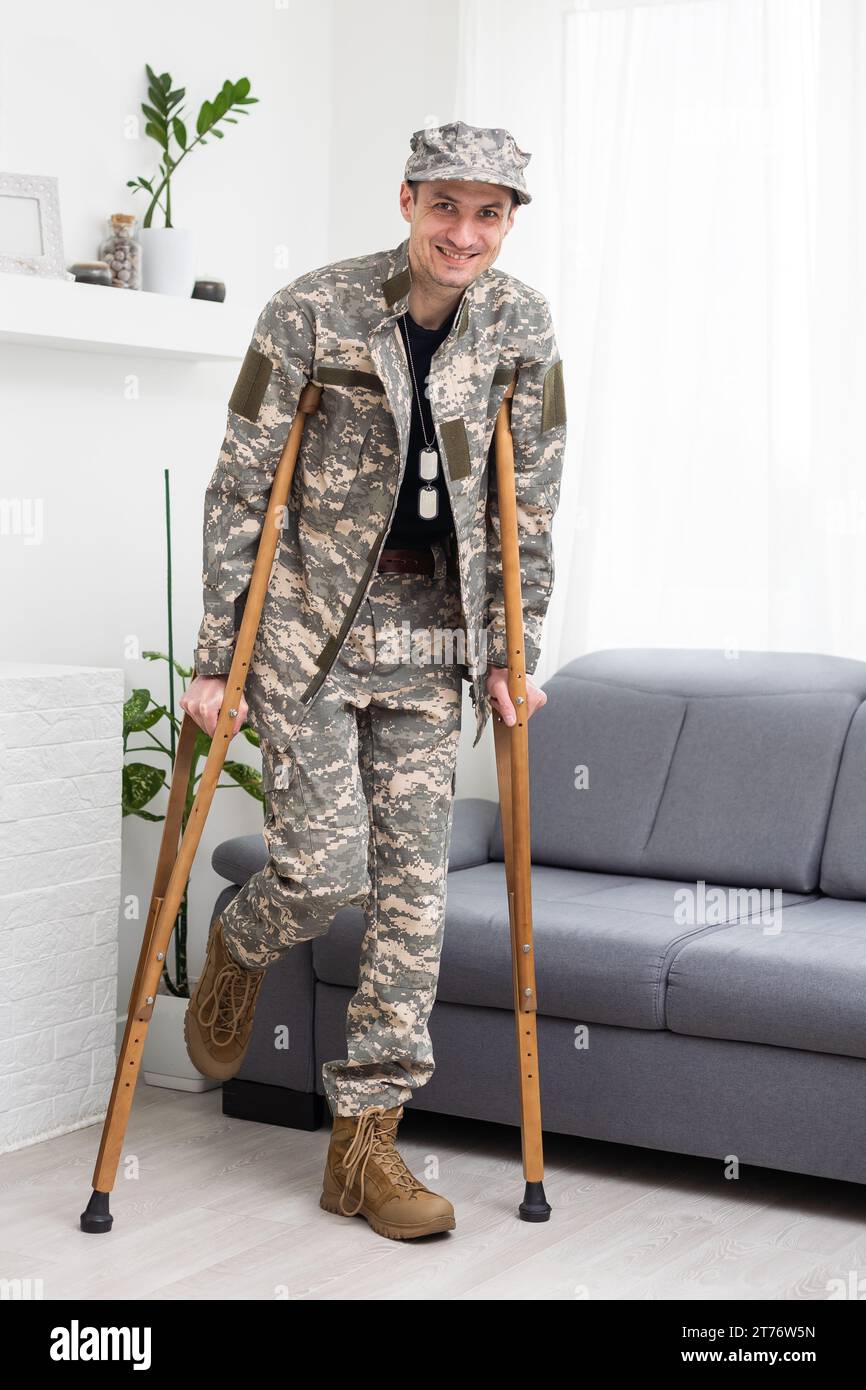 military Wounded Soldier Using Crutch Stock Photo - Alamy