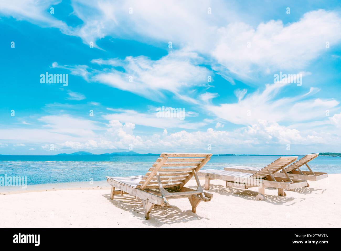 White beach chair on white sand beach. Stock Photo