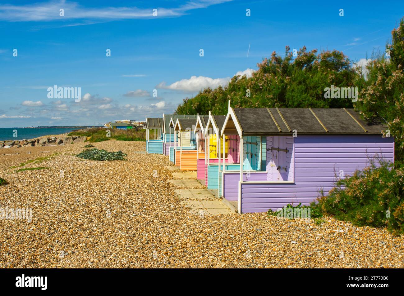 Multicoloured beach huts at Rustington near Littlemapton in West Sussex, England Stock Photo