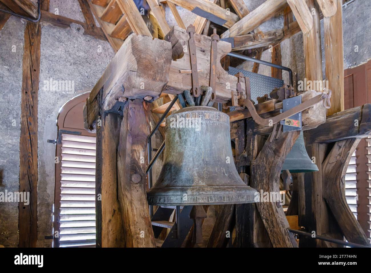 The old church bell inside the belfry at the Augustinian Museum in Rattenberg, Medieval town in Alpbachtal, Tyrol, Austria. Stock Photo