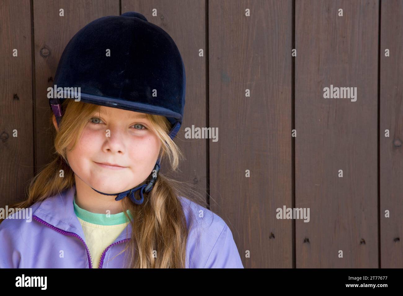 Portrait of a young girl wearing a riding hat Stock Photo Alamy