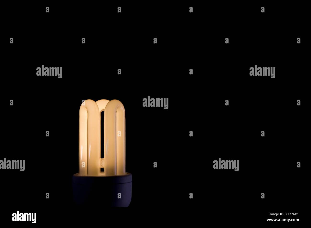 Illuminated energy efficient light bulb Stock Photo