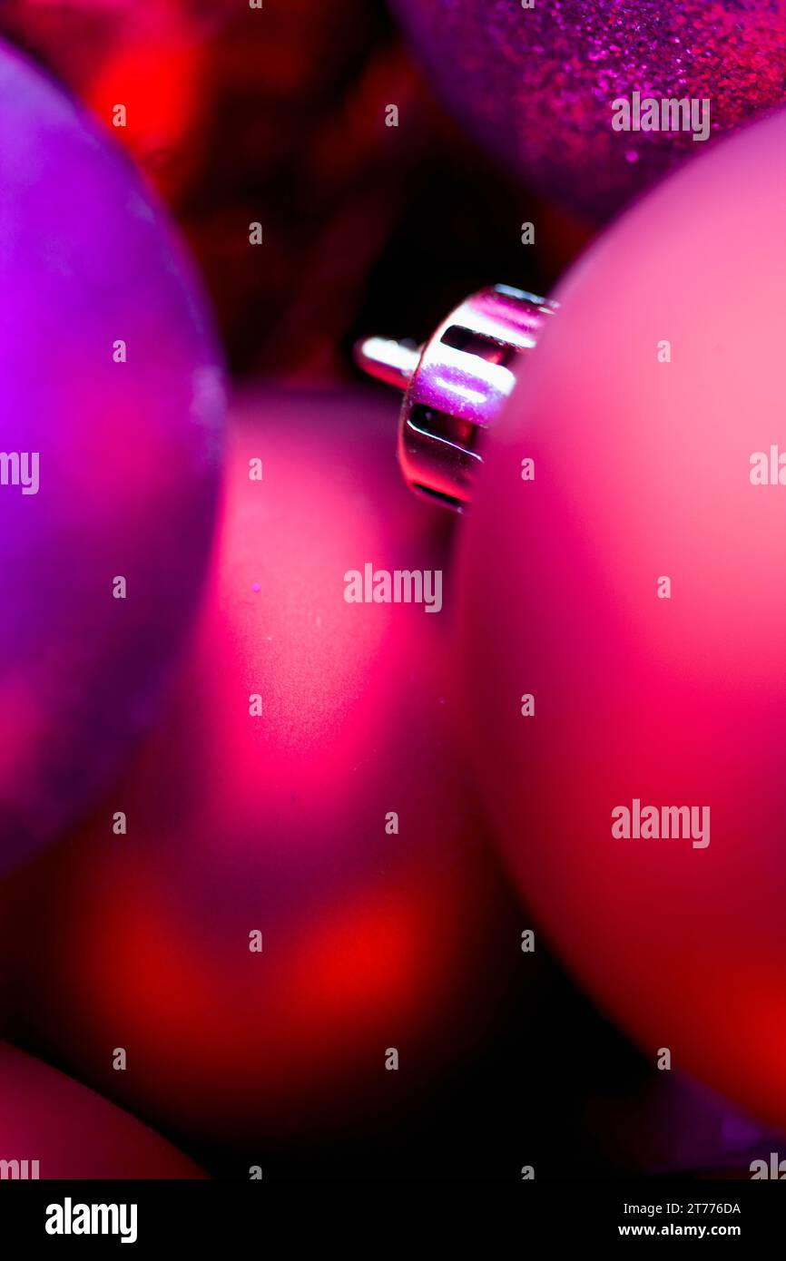 Extreme close up of red and purple Christmas baubles Stock Photo