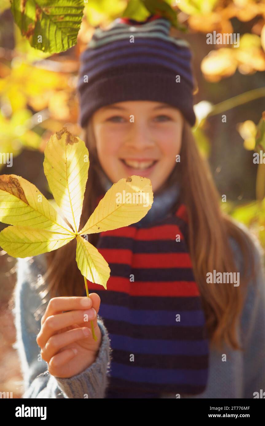 Girl holding a leaf hi-res stock photography and images - Alamy