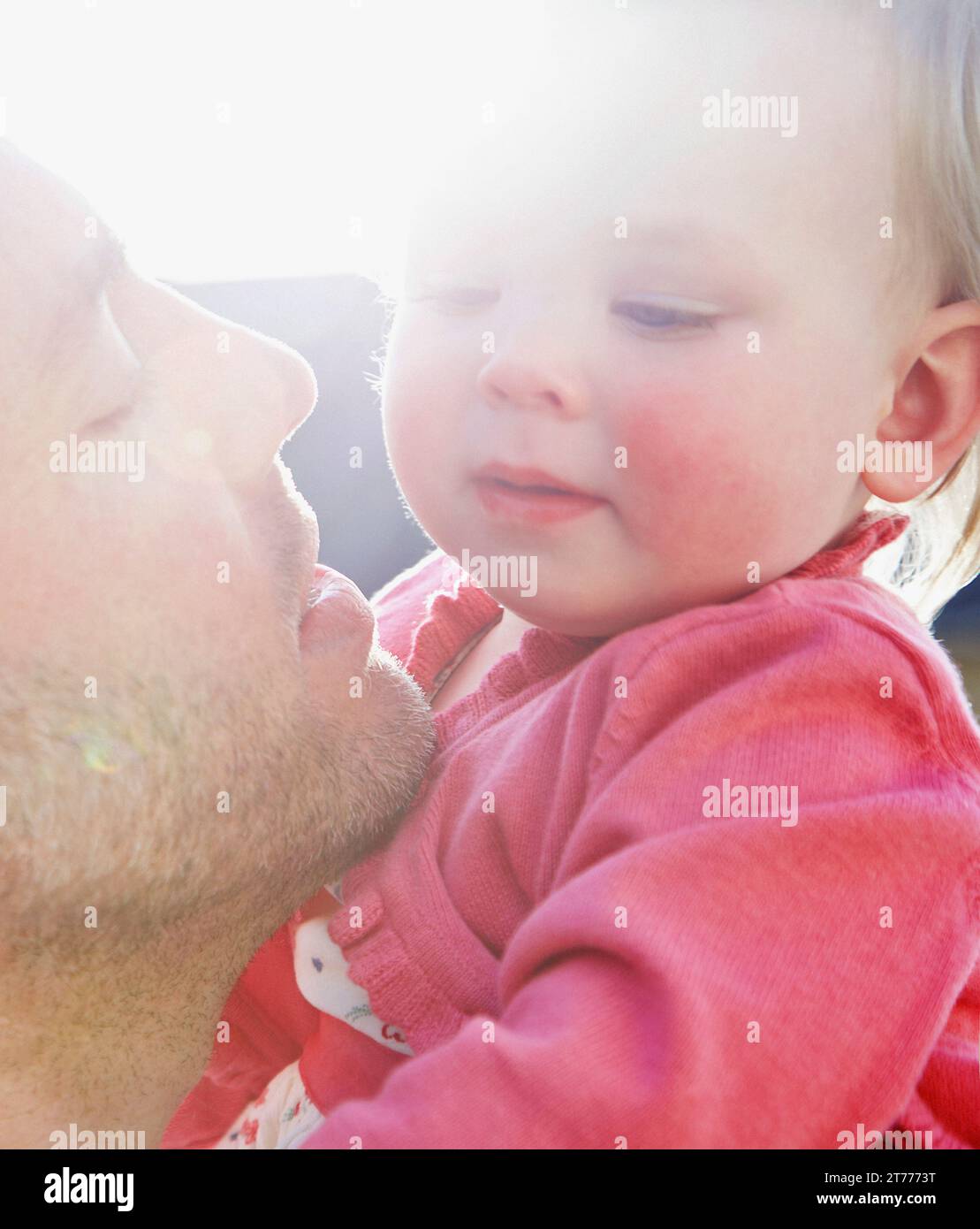 Father Holding Baby Girl, Close-up view Stock Photo