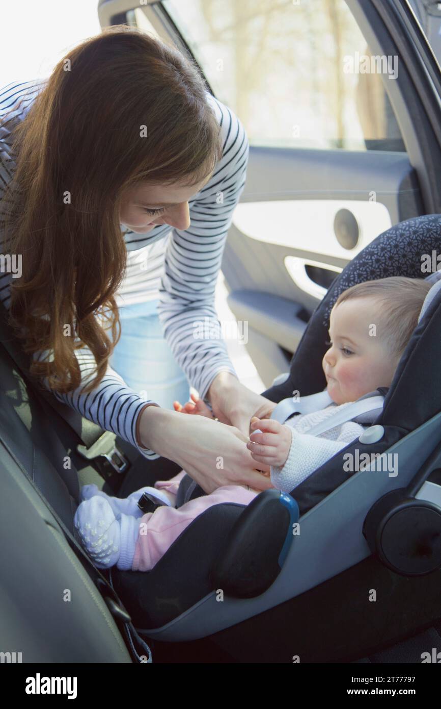 Adjusting baby seat hi-res stock photography and images - Alamy