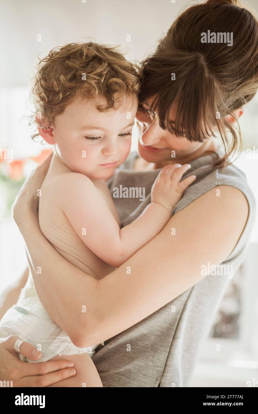 Mother Holding Baby Son Stock Photo