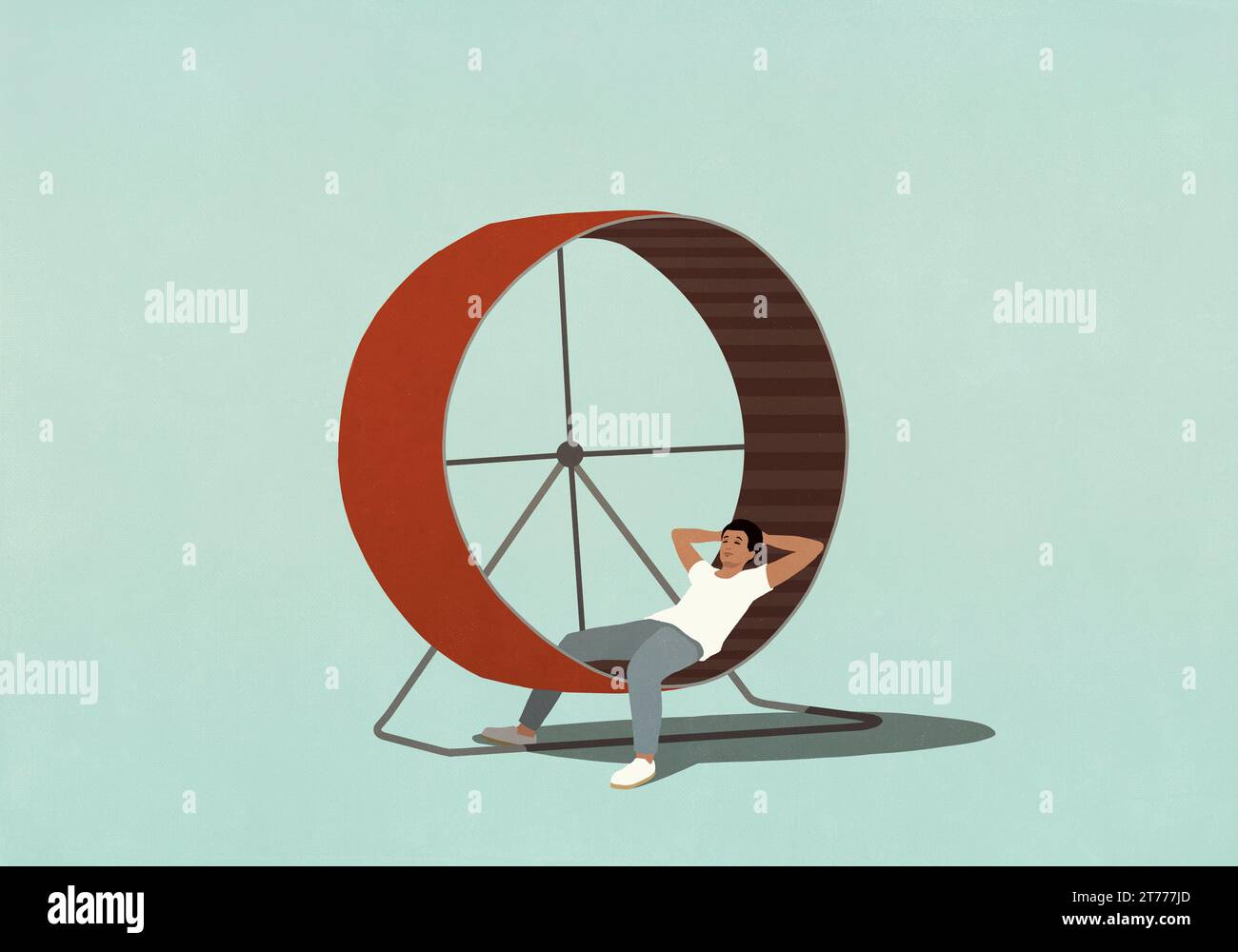 Man relaxing with hands behind head on hamster wheel Stock Photo