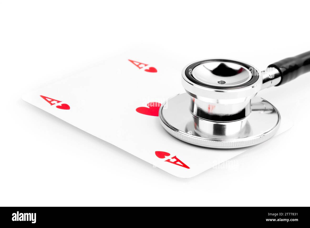 playing card near a stethoscope on the white table Stock Photo