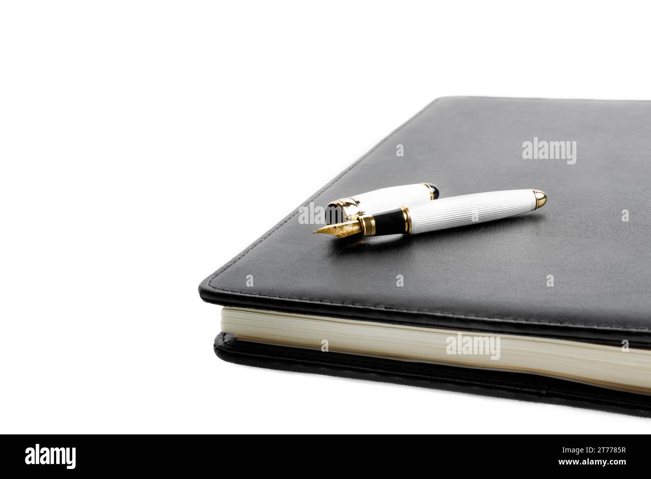 notebook and pen in composition on white background Stock Photo