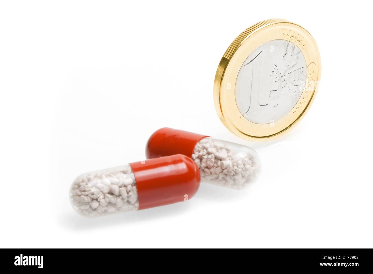 euro coin and medical pills on white background Stock Photo