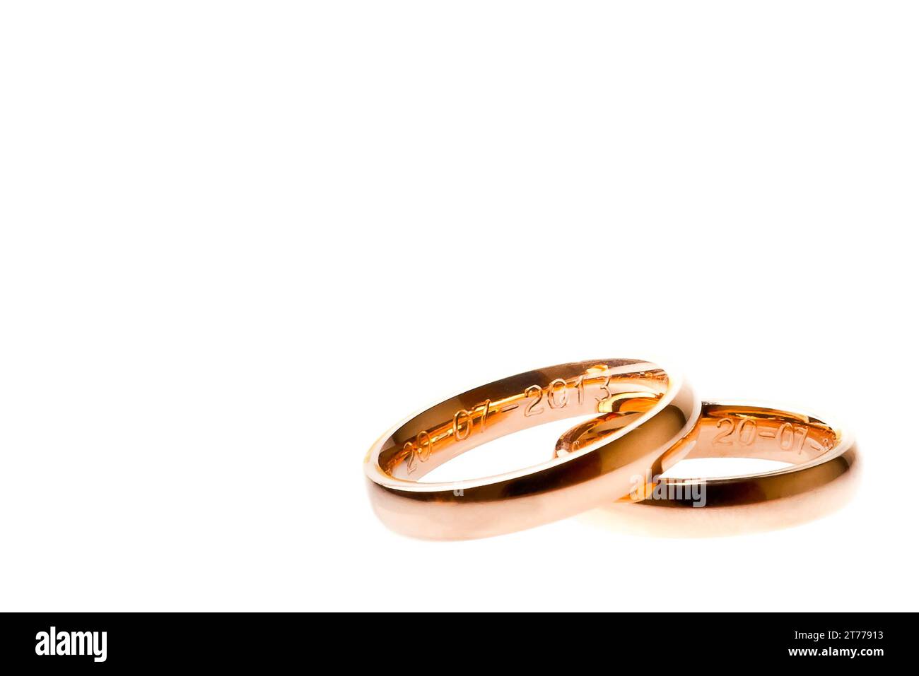 detail of gold wedding with space for text on white background Stock Photo