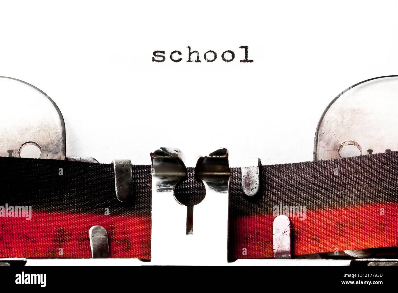 concept image with word school printed on an old typewriter Stock Photo